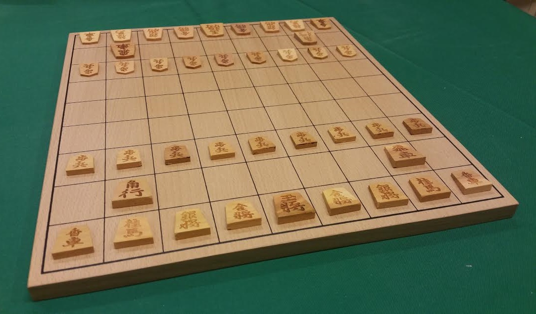 Small wooden shogi pieces